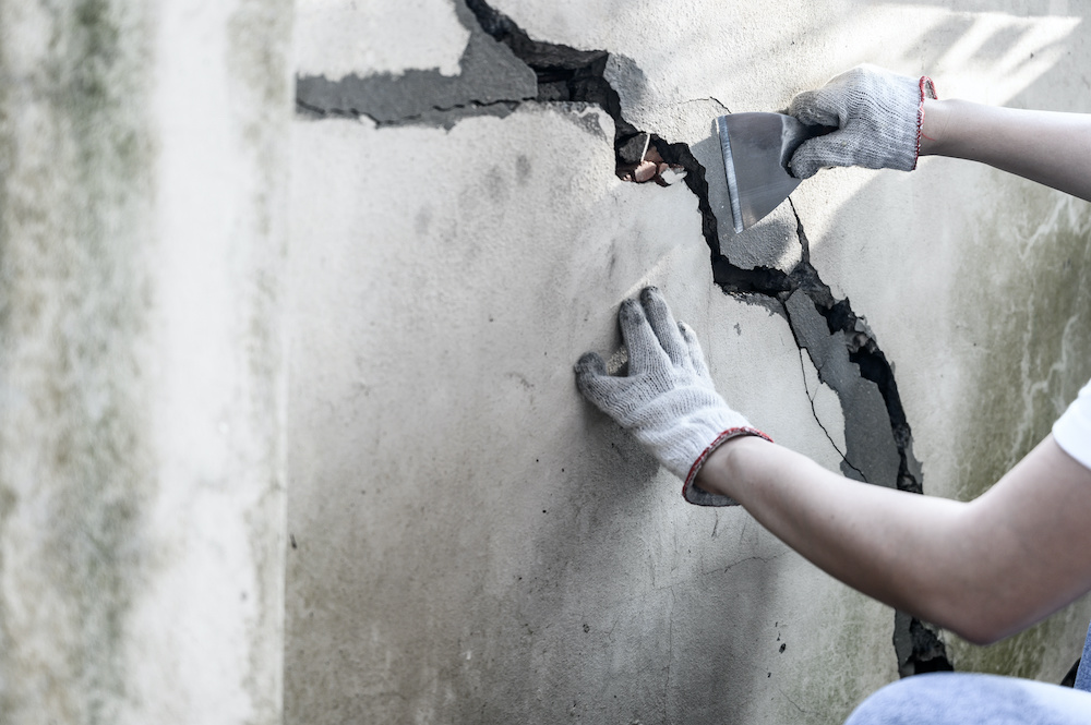 Cracks in concrete walls demand thorough assessment and effective patching techniques